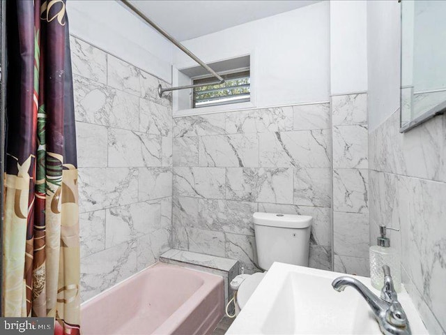 full bathroom featuring toilet, sink, and shower / bath combo with shower curtain