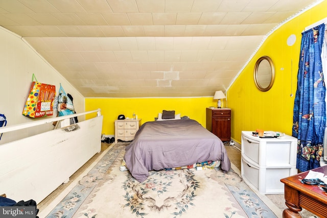 bedroom with lofted ceiling