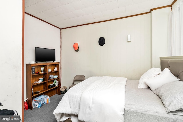 bedroom with carpet floors and ornamental molding