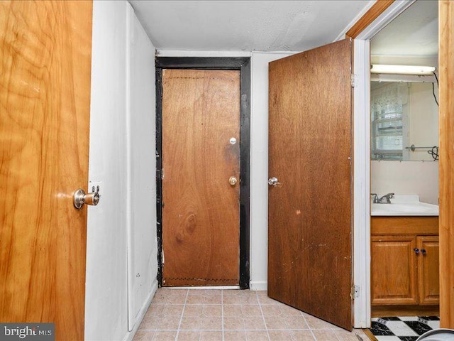 hallway featuring sink