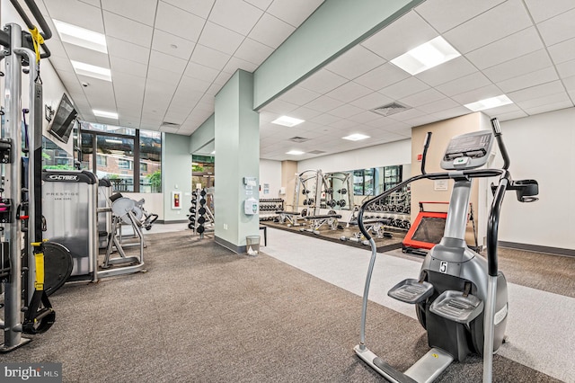 gym with carpet and a drop ceiling