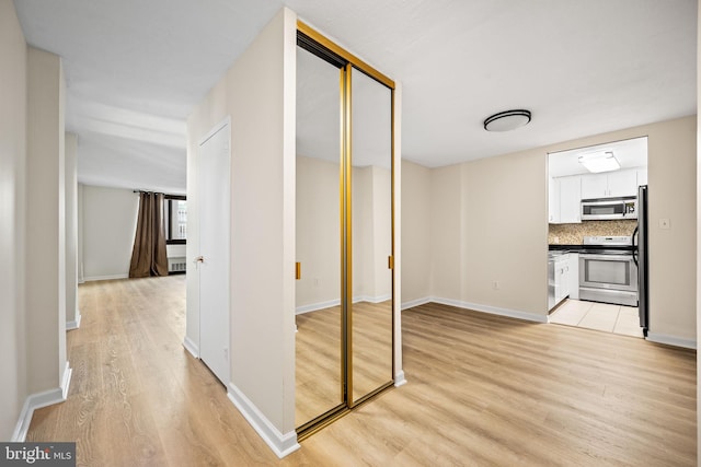 corridor featuring light hardwood / wood-style flooring