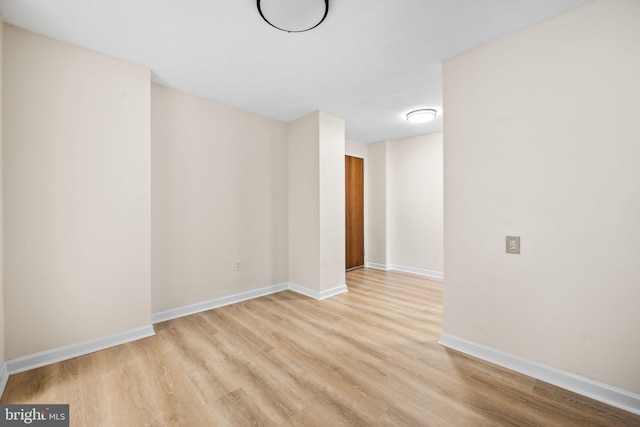 spare room with light hardwood / wood-style flooring