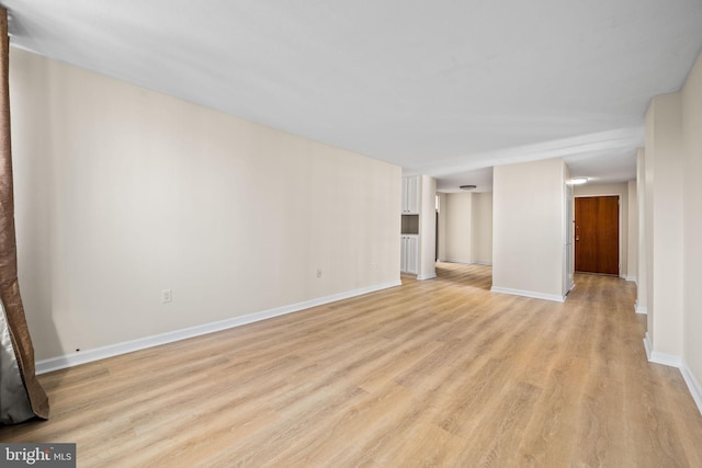 unfurnished living room featuring light hardwood / wood-style flooring