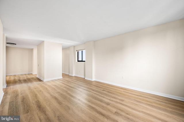 spare room with light hardwood / wood-style floors