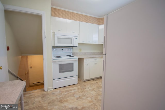 kitchen with white cabinets and white appliances