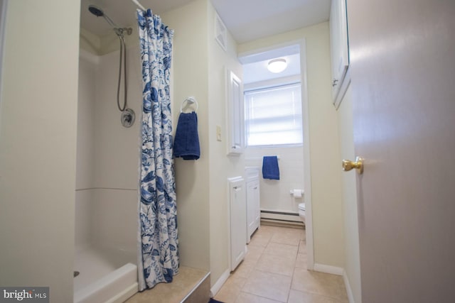 bathroom with toilet, a shower with curtain, tile patterned floors, and a baseboard heating unit