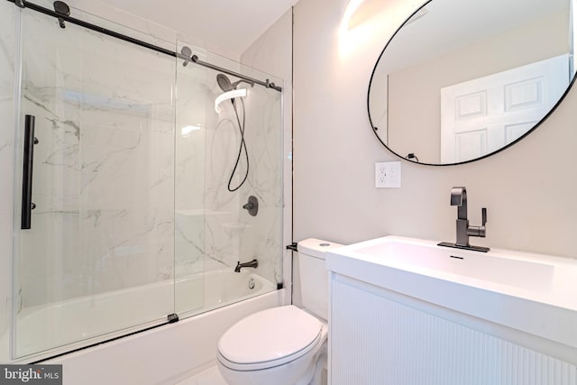 full bathroom with bath / shower combo with glass door, toilet, and vanity