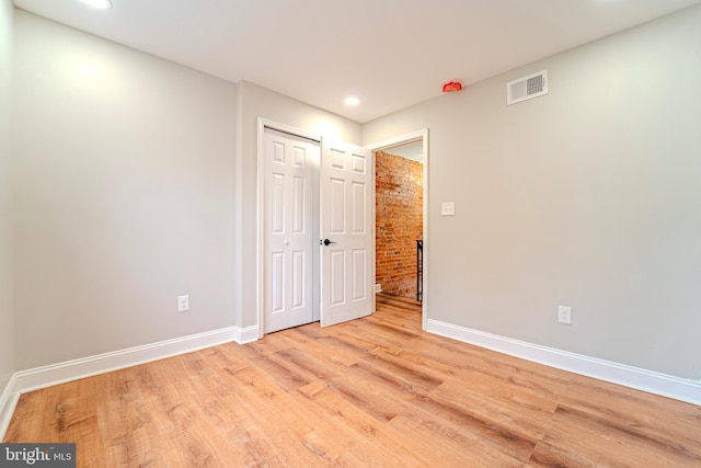 unfurnished room with light hardwood / wood-style floors