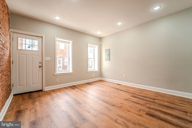 entryway featuring light wood-type flooring and electric panel