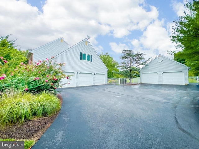 view of side of home featuring a garage