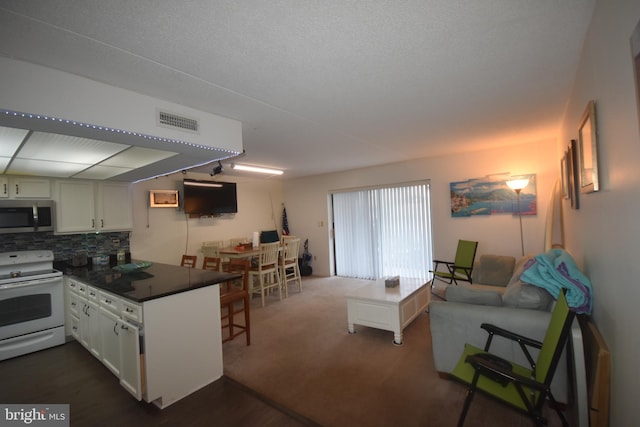 interior space featuring dark colored carpet