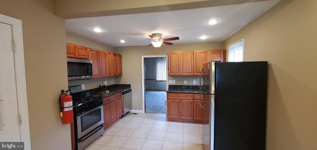 kitchen featuring sink, light colored carpet, ceiling fan, and stainless steel appliances