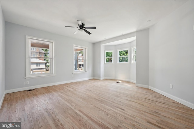 spare room featuring ceiling fan and light hardwood / wood-style floors