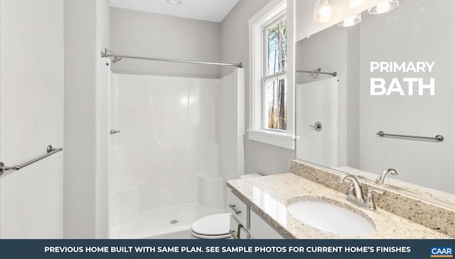 bathroom with a shower, toilet, and vanity