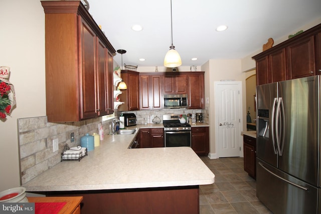 kitchen with backsplash, hanging light fixtures, stainless steel appliances, sink, and kitchen peninsula