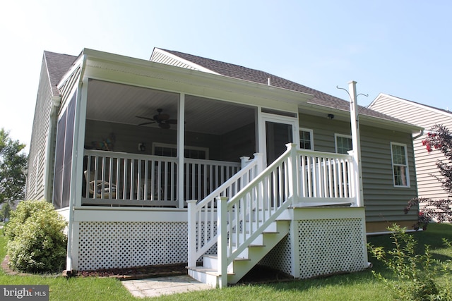 rear view of house with ceiling fan