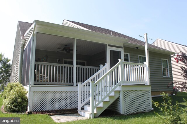 back of property featuring roof with shingles