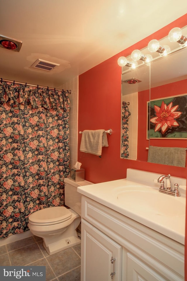 bathroom featuring tile patterned flooring, vanity, toilet, and a shower with shower curtain