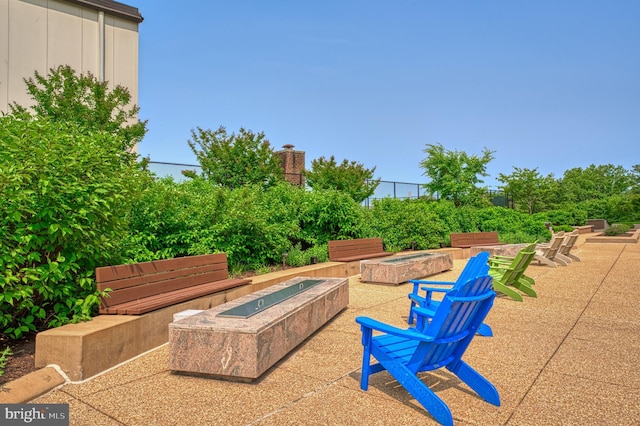 view of patio with an outdoor fire pit