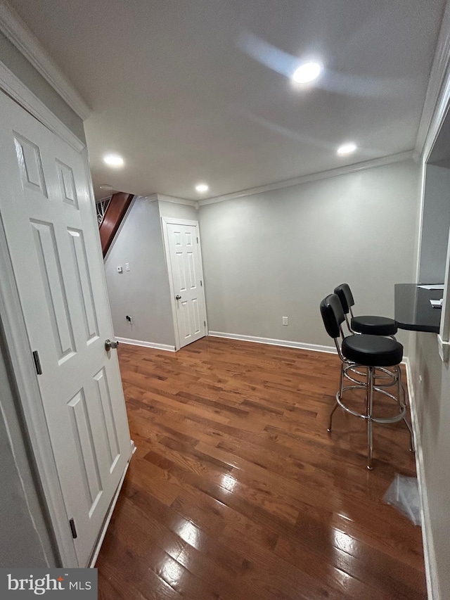 office space featuring crown molding and dark hardwood / wood-style floors