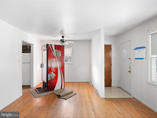 entrance foyer featuring ceiling fan and light wood-type flooring