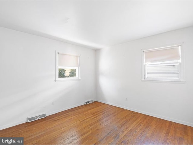 empty room featuring hardwood / wood-style flooring