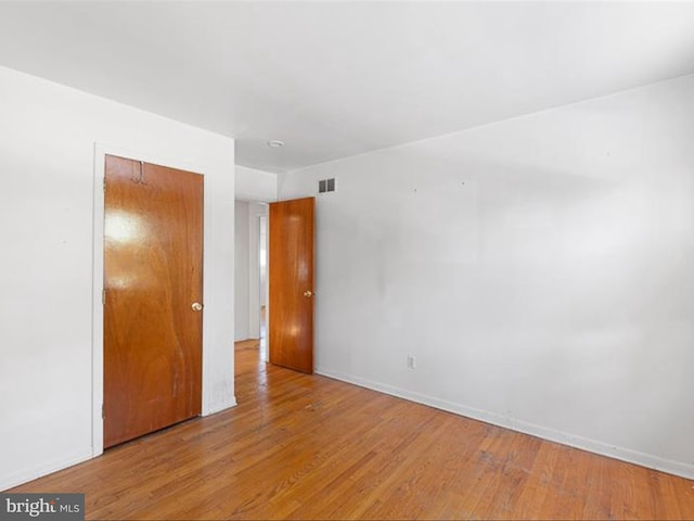 unfurnished room featuring light hardwood / wood-style floors