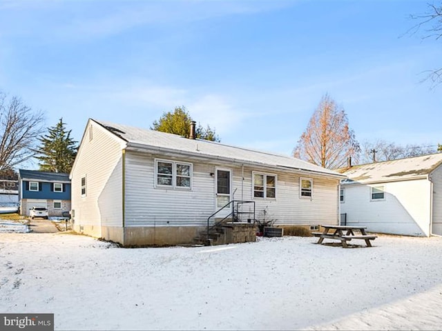 view of snow covered house