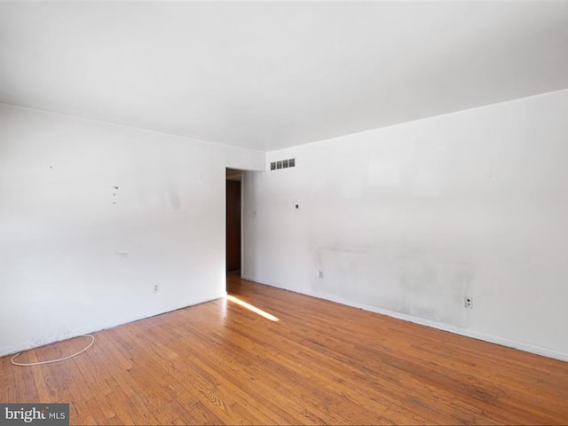 unfurnished room featuring light hardwood / wood-style floors