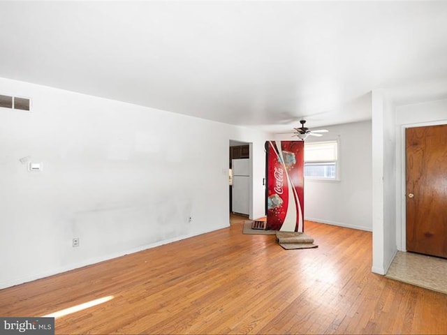 interior space with ceiling fan and light hardwood / wood-style floors