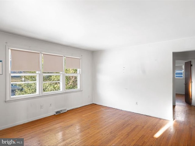 unfurnished room with light hardwood / wood-style flooring