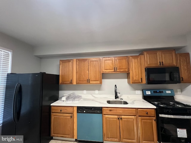 kitchen with sink and black appliances