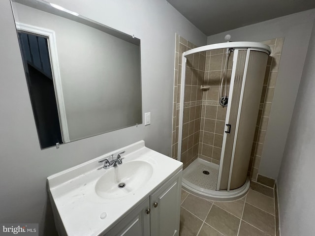 bathroom with vanity, tile patterned flooring, and an enclosed shower