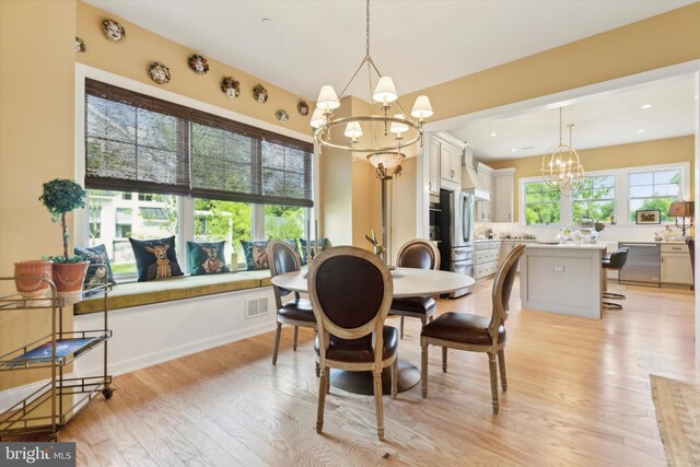 interior space featuring a chandelier and light wood-type flooring