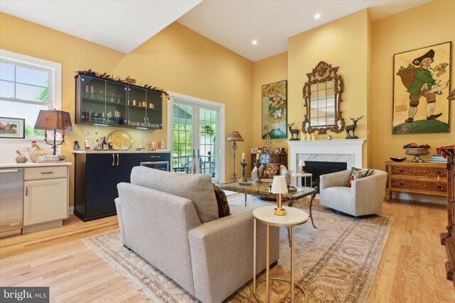 living room featuring light hardwood / wood-style flooring and a fireplace