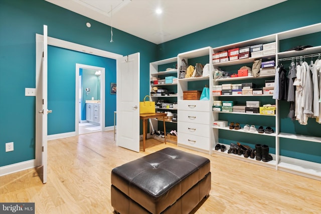 walk in closet featuring light wood-type flooring