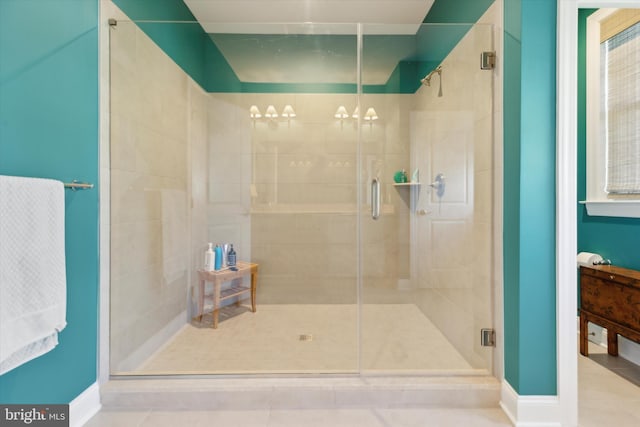 bathroom featuring walk in shower and tile patterned flooring