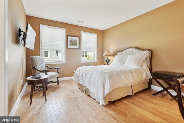 bedroom with light hardwood / wood-style floors