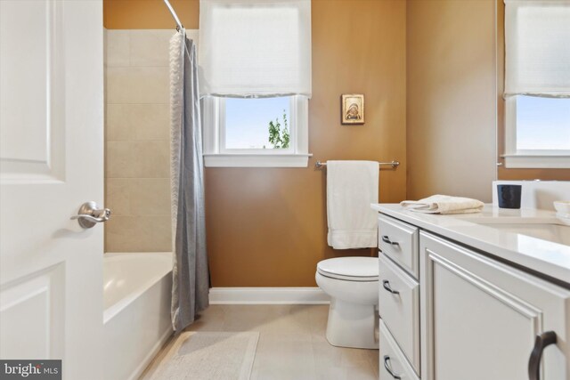 full bathroom featuring tile patterned floors, vanity, toilet, and shower / bath combo