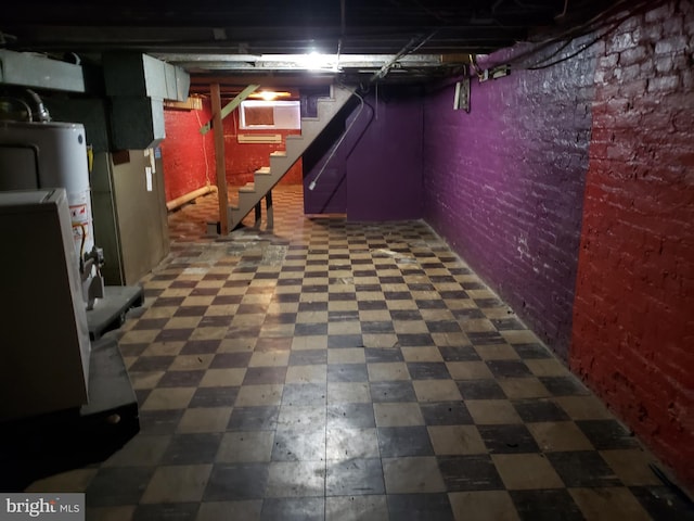 basement with brick wall and gas water heater