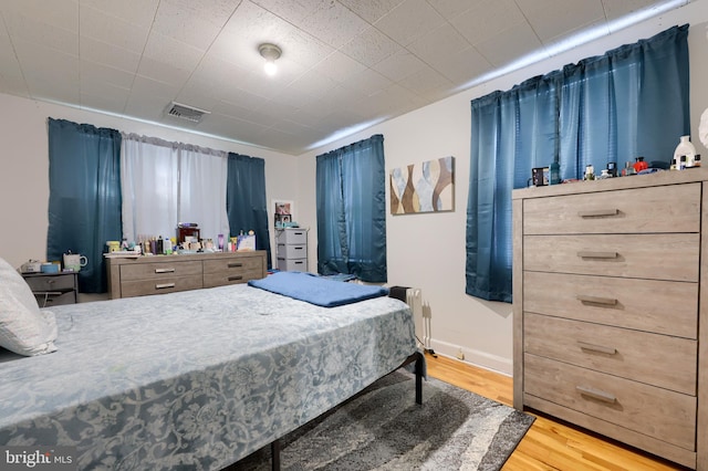 bedroom featuring wood-type flooring