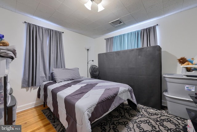 bedroom featuring ceiling fan and light wood-type flooring