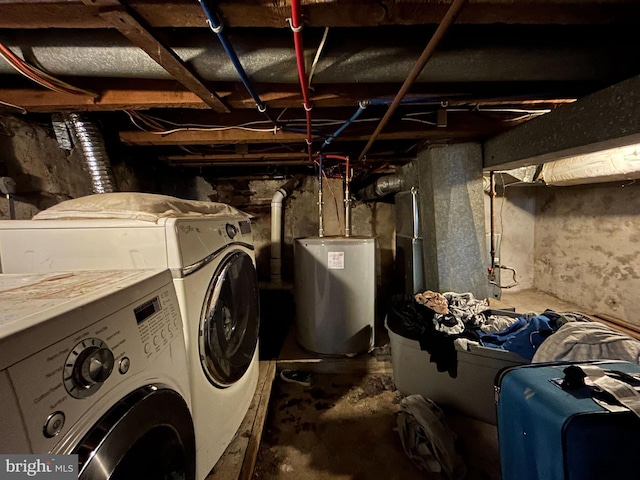 laundry area featuring water heater and independent washer and dryer