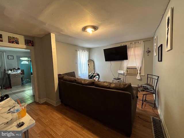 living room with wood-type flooring and cooling unit