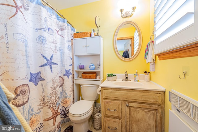 bathroom featuring toilet and vanity