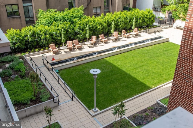 view of yard with an outdoor fire pit and a patio area