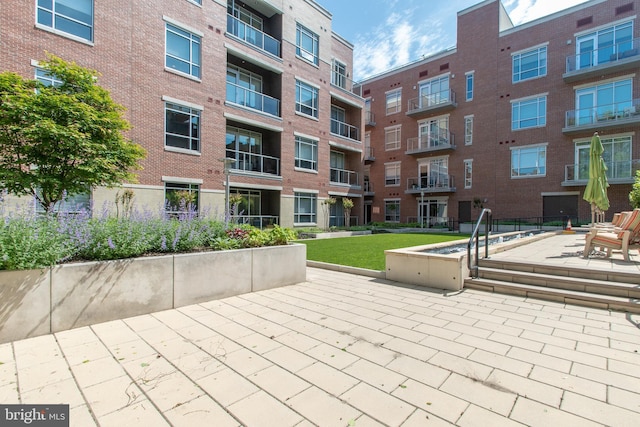 view of home's community featuring a patio