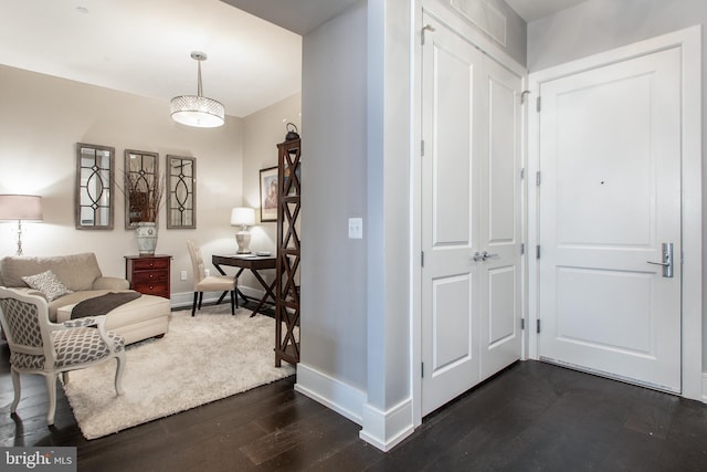 interior space with dark hardwood / wood-style floors