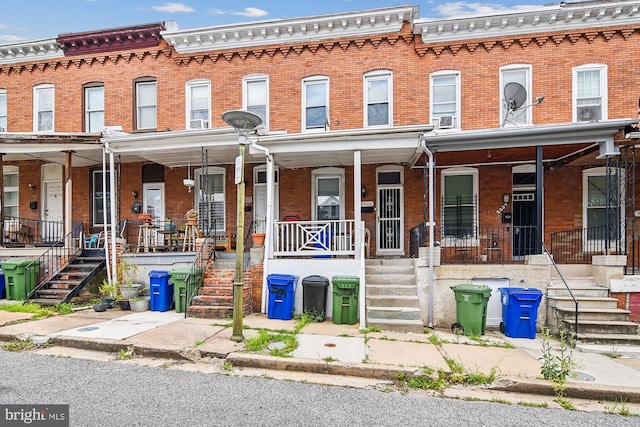 view of property with cooling unit and covered porch